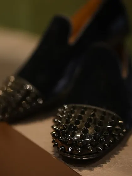 We create footwear for every facet of a man's identity, from the classic to the contemporary. These custom black velvet loafers with studded toe caps are for the man who is unafraid to make a bold statement, proving that elegance can have an edge.
