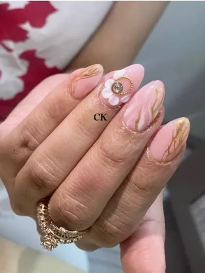 A side view of the pink marble and 3D flower set, showing the dimension and intricate details of the design.