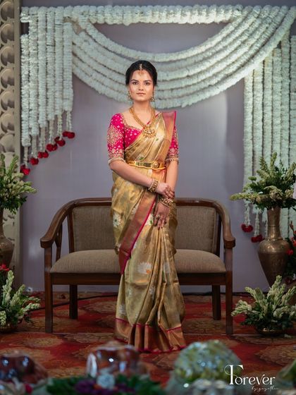 A portrait of grace for a Muhurtham ceremony. This look blends classic tradition with modern charm, featuring soft makeup that enhances her individuality while honoring the elegance of her South Indian heritage.