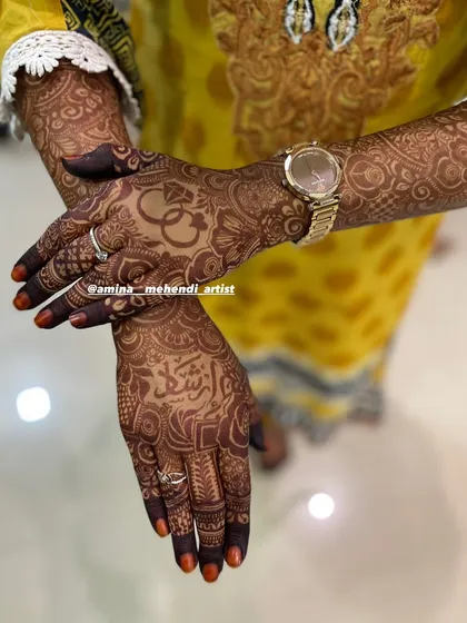 A different pose showing the one-day stain. This design features a ring motif and a name in Arabic script.