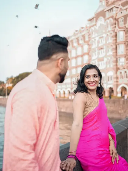 A candid moment of laughter and joy during a pre-wedding shoot near the Taj Mahal Palace Hotel in Mumbai.