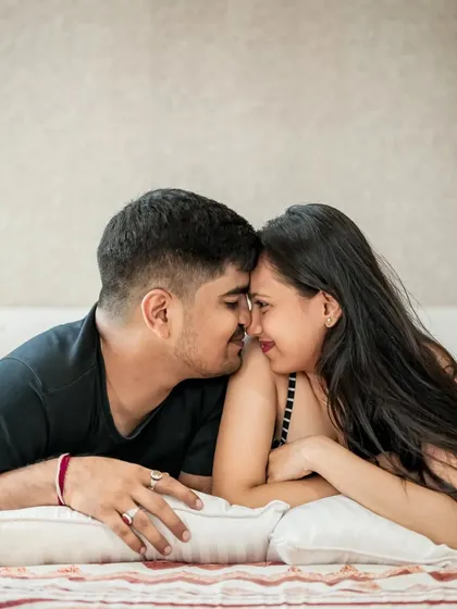 A romantic and intimate shot from a cozy indoor pre-wedding session, perfect for capturing the couple's comfortable love.