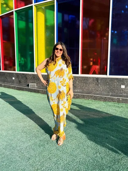 Wearing a beautiful printed, one shoulder kaftan by Shivan and Narresh at their show. This demonstrates how I integrate a designer's pieces into my own style when attending their events.