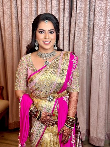 A final portrait of the reception look, showing the glowing skin, defined eyes, and beautiful smile.