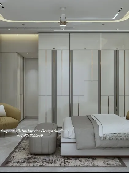 This angle showcases the full-wall wardrobe with its clean, modern lines, providing ample storage while maintaining a sleek look.