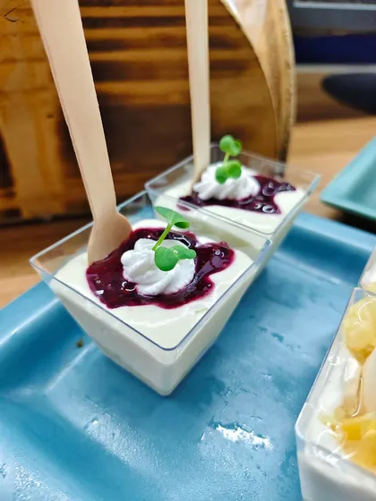 When dessert looks like art and tastes even better. These beautiful panna cotta cups are topped with a vibrant berry compote and fresh microgreens.
