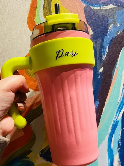 A close-up of our popular doll-themed tumbler in pink and neon. This tumbler is part of a larger trend-inspired collection of personalised items.