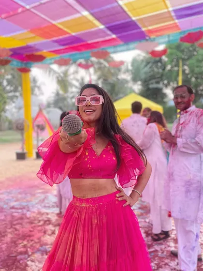 Let's get started. Hosting a Haldi-Holi celebration in Goa, where the energy is as bright and colorful as my outfit and the festive decor.