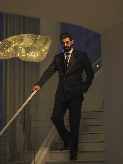 A full-length view of Rana Daggubati's IIFA look, showing how the double-breasted tuxedo creates a strong, statuesque silhouette. It’s all about confident and timeless red carpet style.