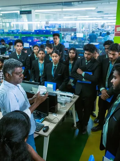 A group of curious students from Koshys Institute of Management Studies gathered around a workstation. Our team member explains the intricacies of our production process and quality control measures.
