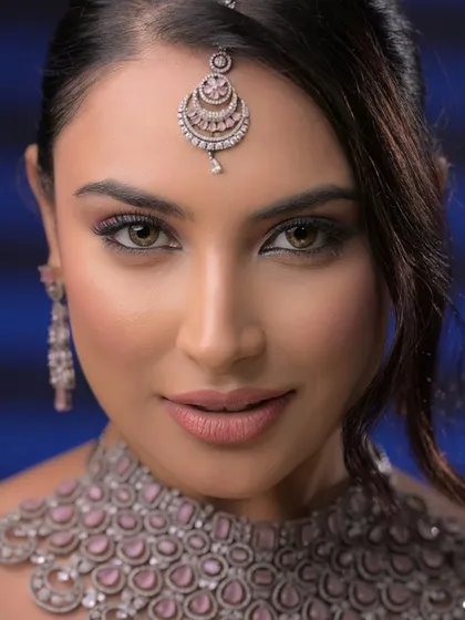 A beauty makeup look styled for a professional jewelry shoot, teaching students how to focus on highlighting products.