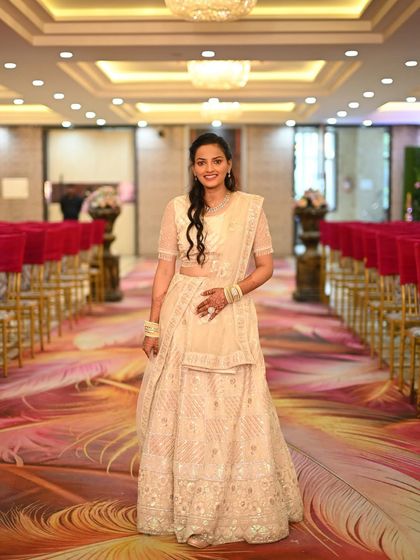 This elegant off-white lehenga is perfect for a daytime wedding or reception. The subtle embroidery and lightweight fabric make it comfortable and beautiful.