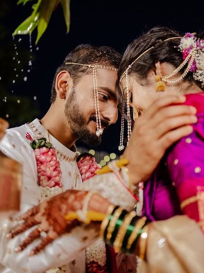 An intimate moment during the wedding rituals, full of emotion and tradition.