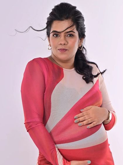 A confident look towards the camera. The simple, elegant makeup ensures that her expression and the emotion of the moment are the main focus.