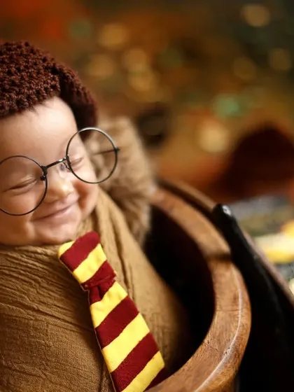 A perfect, magical smile from this newborn Harry Potter. These expressive moments are what make each themed photoshoot a unique and treasured investment.