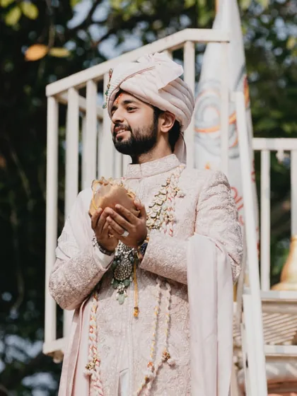 The groom on his way to the temple, embodying grace and tradition.