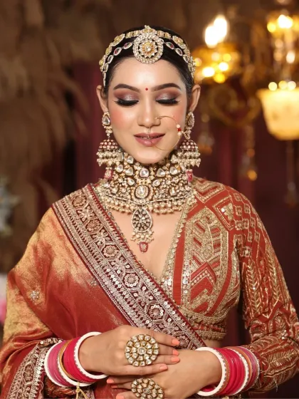 An eyes-closed shot highlighting the beautiful, soft eye makeup. This look is a dream for any bride wanting a touch of glamour.