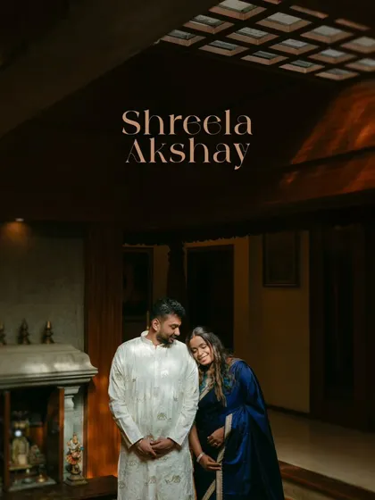 A warm, cozy portrait of Shreela and Akshay. Her head resting on his shoulder in this beautifully lit indoor setting speaks of home, comfort, and deep affection.