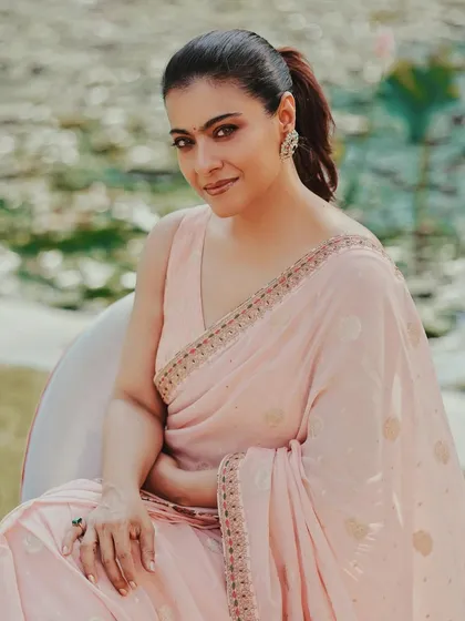 Pretty in pink. We styled Kajol in this soft pink saree from Label Anushree for her movie promotions in Kolkata, creating a look of effortless grace.