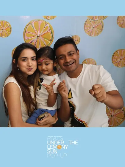 A happy family captured at the PTAT 'Under the Lemony Sun' pop-up. Our booths are family-friendly and create wonderful keepsakes for parents and children alike.
