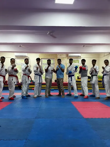 My team, my pride. This is a group of dedicated students at the dojo, ready for their karate training session. We are a community built on mutual respect and the shared goal of becoming stronger, both mentally and physically.