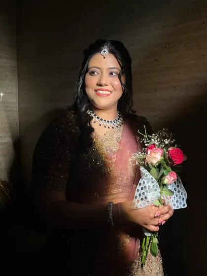 A happy, smiling bride in the shadows.