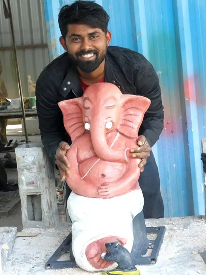 Here I am with a finished Ganesha sculpture, my first friend in art. This piece, from its peaceful, meditative expression to the little mouse at his feet, is ready to bring blessings to a new home.