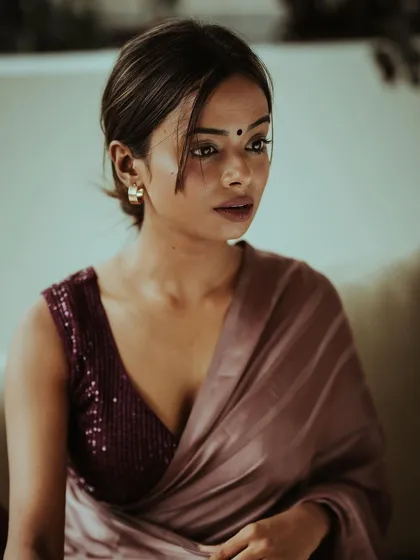 An intimate portrait focusing on the quiet, unspoken feelings. I used soft, natural light to highlight the delicate details of the satin saree and the model's expressive gaze, creating a photo that feels both classic and personal.