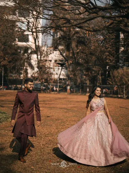 A playful moment during the engagement shoot, with the bride twirling her lehenga. It adds movement and fun to the photos.