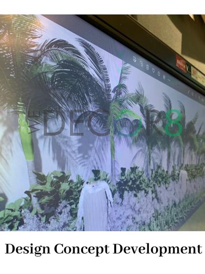 The first step in our process is Design Concept Development. Here, we are presenting a 3D rendering of a landscape design to a client on a large screen, allowing for discussion and feedback.
