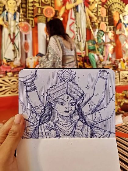 Another sketch from the same pandal, this time of the goddess Durga. Capturing the energy and devotion of the festival was a powerful experience.