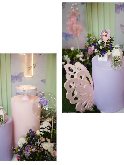 Detailed shots of the fairy party decor, including a glowing 'T' initial, a butterfly-wing-shaped prop, and floral arrangements in pastel purple and pink.