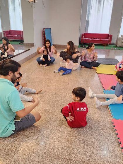 A session in progress with toddlers and their moms. These classes are a great way for parents to participate and encourage their little ones.