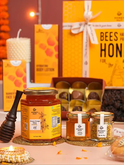 A festive flat lay of a Diwali gift hamper featuring various honey products. We excel at creating elaborate, themed compositions for special occasions.