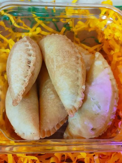A detailed shot of the perfectly shaped Desi Ghee Gujiyas, a must-have for any Holi festival.