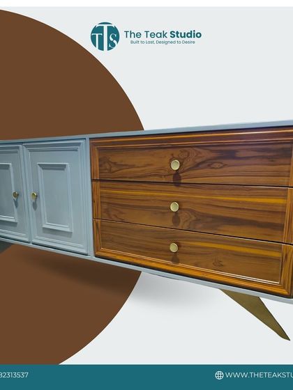 This dual-tone cabinet showcases a beautiful contrast between classic panelled doors in a soft grey finish and natural teak wood drawers. The elegant legs and simple hardware complete the transitional design.