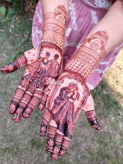 The beautiful dark stain of a personalized bridal mehndi. This design features a couple portrait and tells a story that is now permanently etched for the wedding festivities.