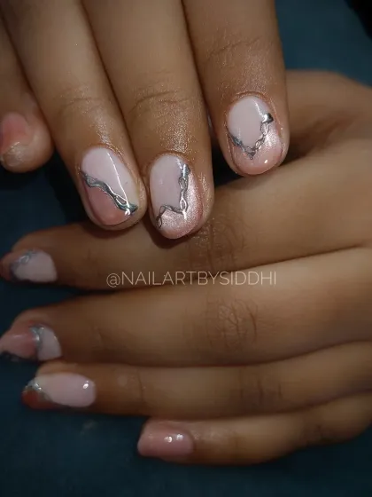 A full view of the abstract silver chrome line work, showing a modern and artistic style.