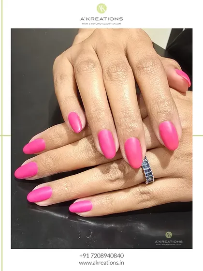 This view shows the flawless application and beautiful shape of these matte pink nails. A matte topcoat completely transforms a color, giving it a modern and sophisticated feel.
