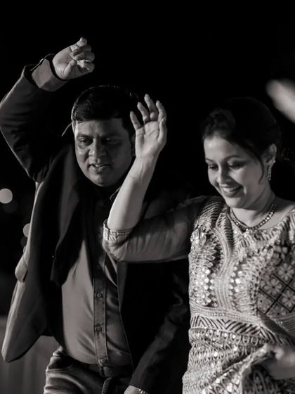 A beautiful black and white shot capturing the joy of dancing together. Sometimes a simple photo says it all.