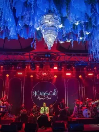 A breathtaking view of the entire stage setup under magnificent chandeliers. This is the level of grandeur we bring to high-end events.