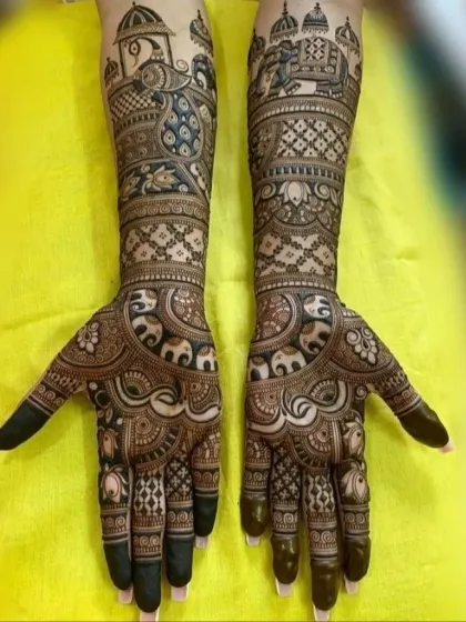 This is a classic Rajasthani bridal mehndi design featuring majestic elephants and palace architecture. It shows the rich detail and traditional motifs I can incorporate into your full arm mehndi.