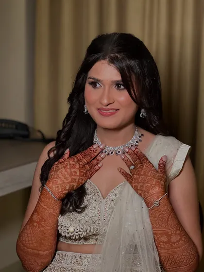 A smiling portrait of Prerna, her makeup looking fresh and glamorous.