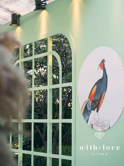 A detail of the custom bar in 'The Conservatory', with a bird illustration adding a personalized touch.