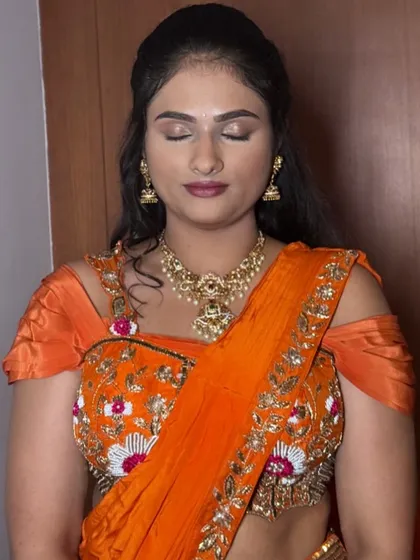 Another angle of Rekha's makeup, highlighting the gentle contouring and soft eyeshadow that define her features naturally.