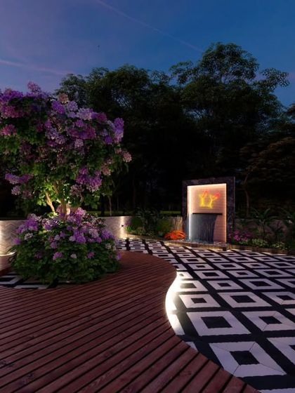 An evening render showing a curved deck, illuminated tree, and a water feature.