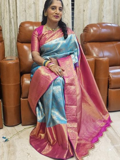 Our client Vijetha looks beautiful in a designer silk saree with a classic combination of pink and blue.