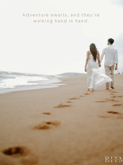 Footprints in the sand leading towards the ocean in Goa. This symbolic image of the couple walking hand-in-hand represents the beginning of their shared journey, a simple but powerful pre-wedding concept.