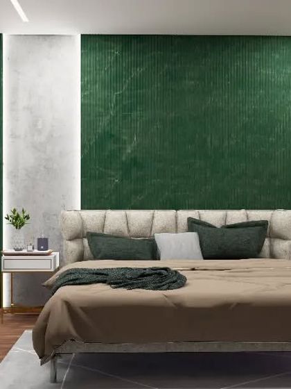 A master bedroom concept featuring a bold, textured green accent wall. This powerful design choice is balanced by a neutral upholstered bed and warm wooden flooring, creating a space that is both vibrant and grounded.