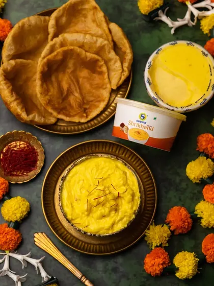 This shot includes the product packaging for the Shrikhand, making it a perfect image for brand advertising or e-commerce listings.